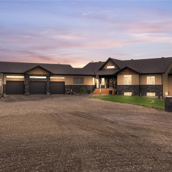 View of front facade with a triple attached garage