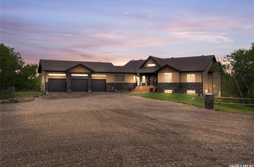 View of front facade with a triple attached garage