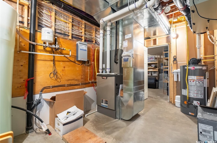 Utility room featuring furnace and water heater