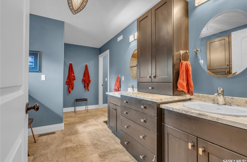 Bathroom with dual sinks and vanity