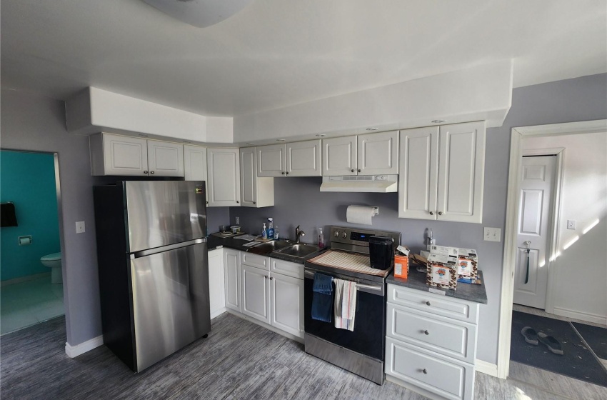 Kitchen with sink and appliances with stainless steel finishes