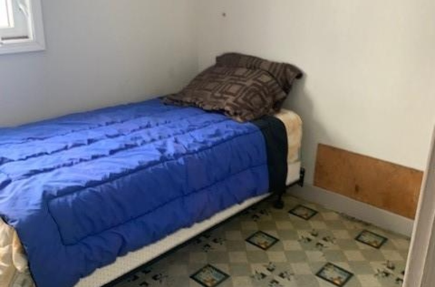 Bedroom featuring lofted ceiling