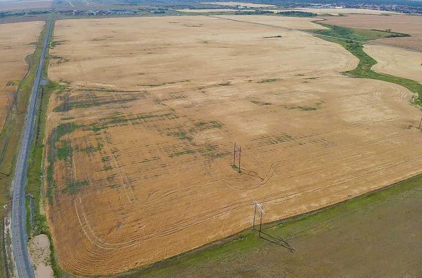 On North boundary looking south, CP rail line along East.