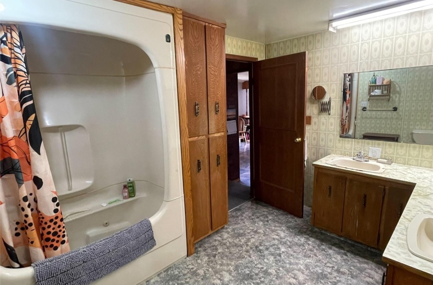 Bathroom featuring vanity and shower / bath combo