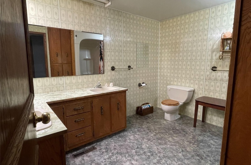 Bathroom with vanity and toilet