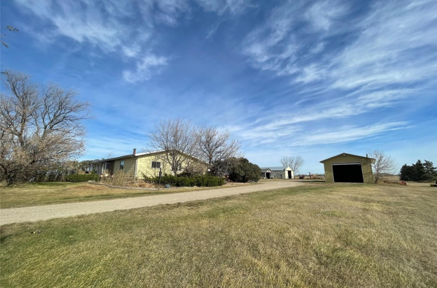 View of yard with an outdoor structure and a garage