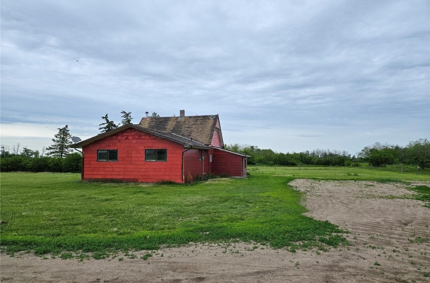 View of side of property with a yard