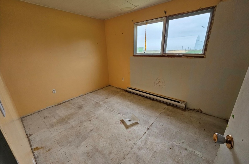 Empty room with a baseboard radiator