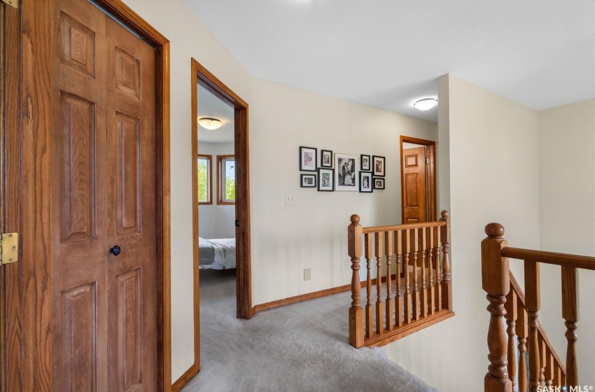 Hallway with carpet flooring