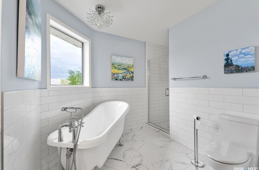 Bathroom featuring independent shower and bath, tile walls, toilet, and tile patterned floors