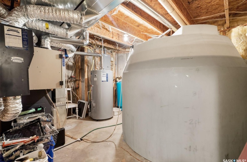 Utility room featuring gas water heater