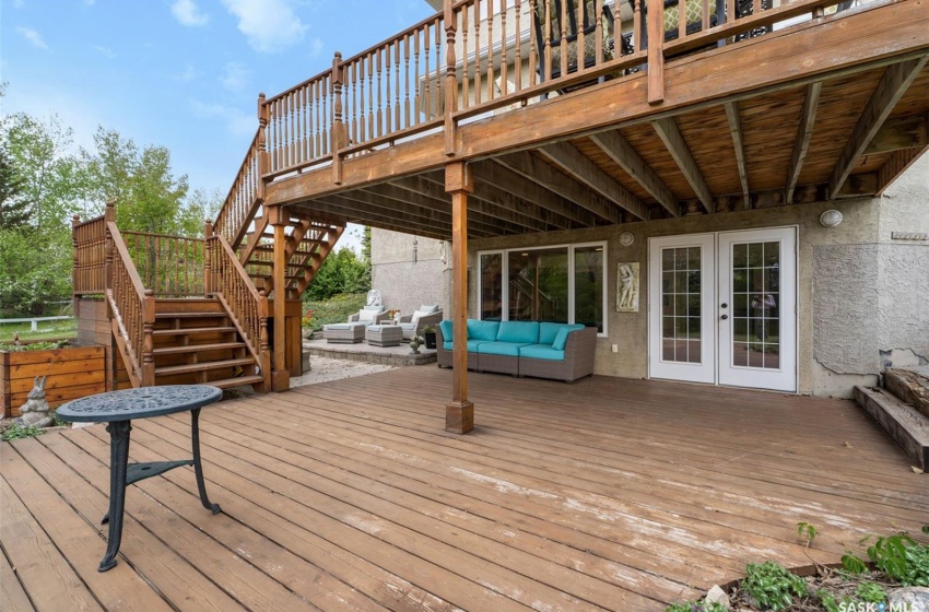 Deck with french doors and an outdoor hangout area