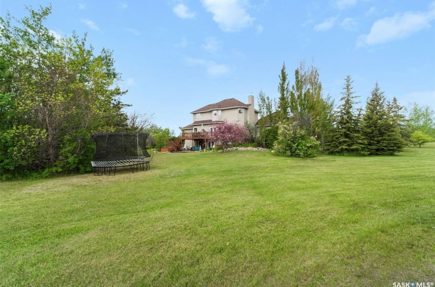 View of yard with a trampoline