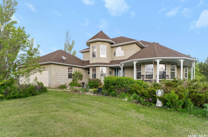 Rear view of house with a lawn