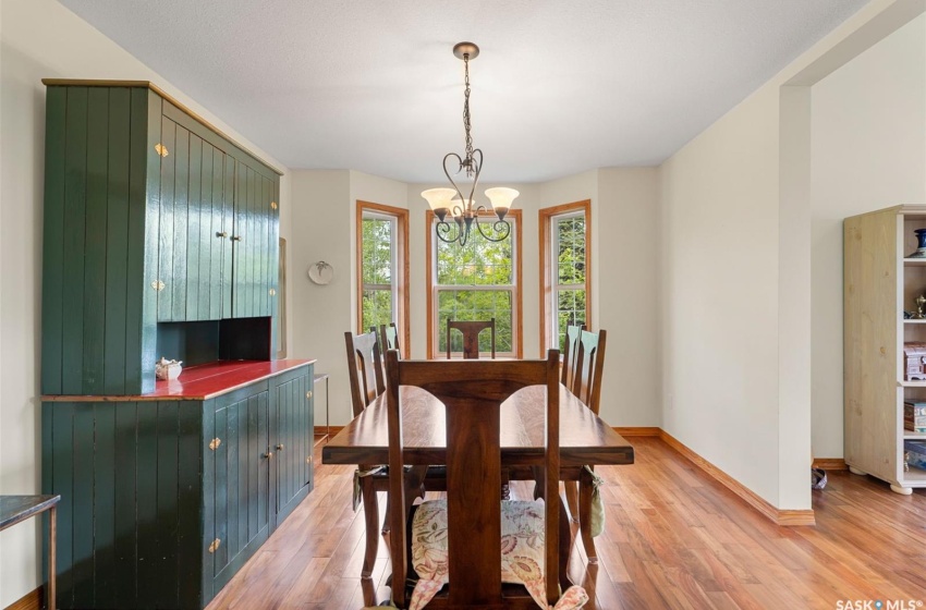 Dining area featuring light hardwood / wood-style floors and a chandelier