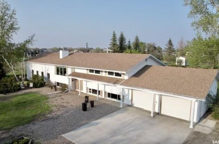 Back of house with a garage