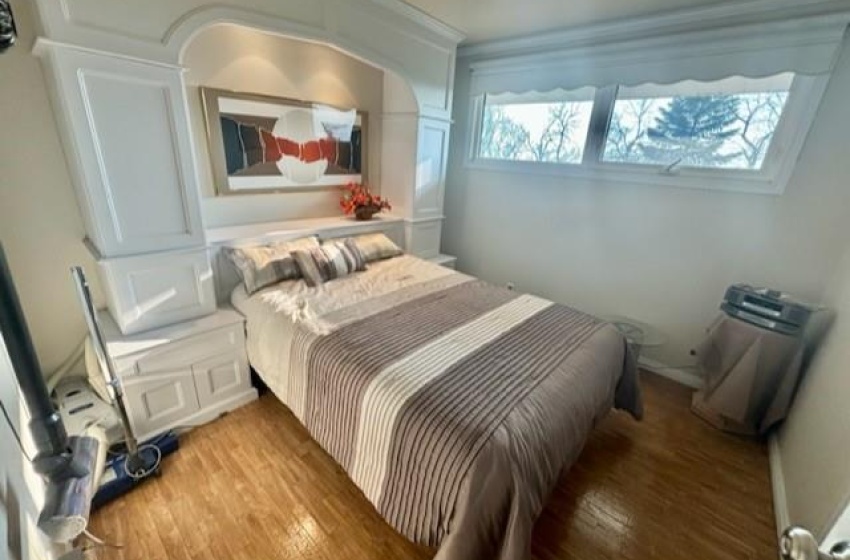 Bedroom with light hardwood / wood-style flooring