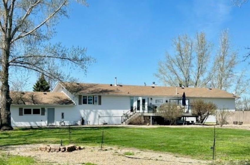 Rear view of house featuring a yard