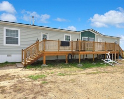 Back of house featuring a deck