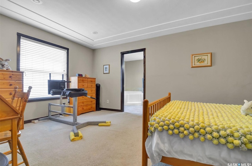 Bedroom featuring carpet and ensuite bath