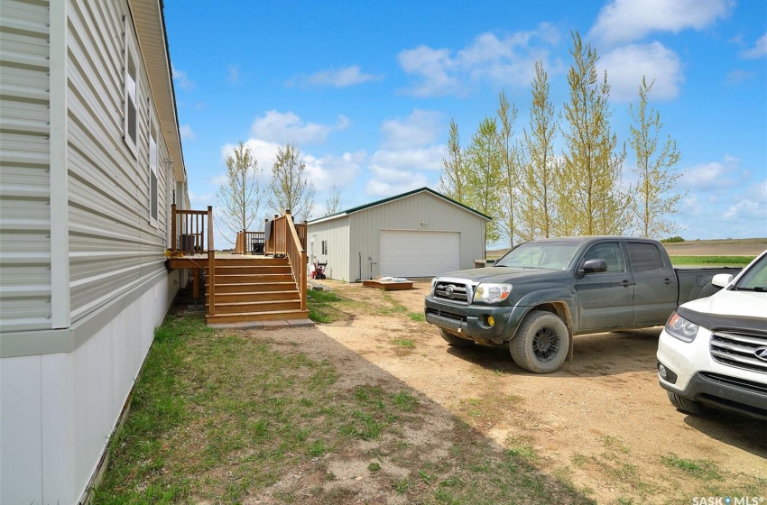 View of yard featuring a garage and an outdoor structure