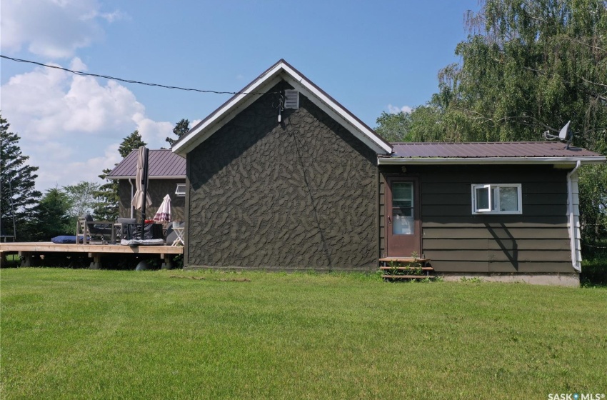 Back of house featuring a lawn