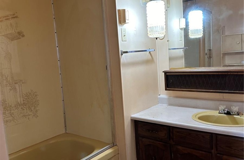 Bathroom with bathtub / shower combination, a textured ceiling, vanity, and tile flooring