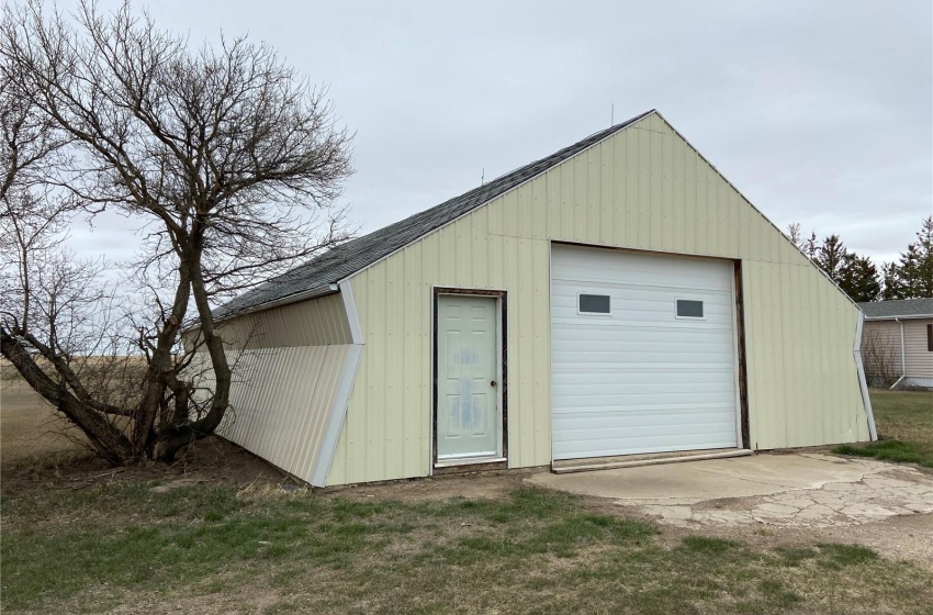 Garage featuring a yard