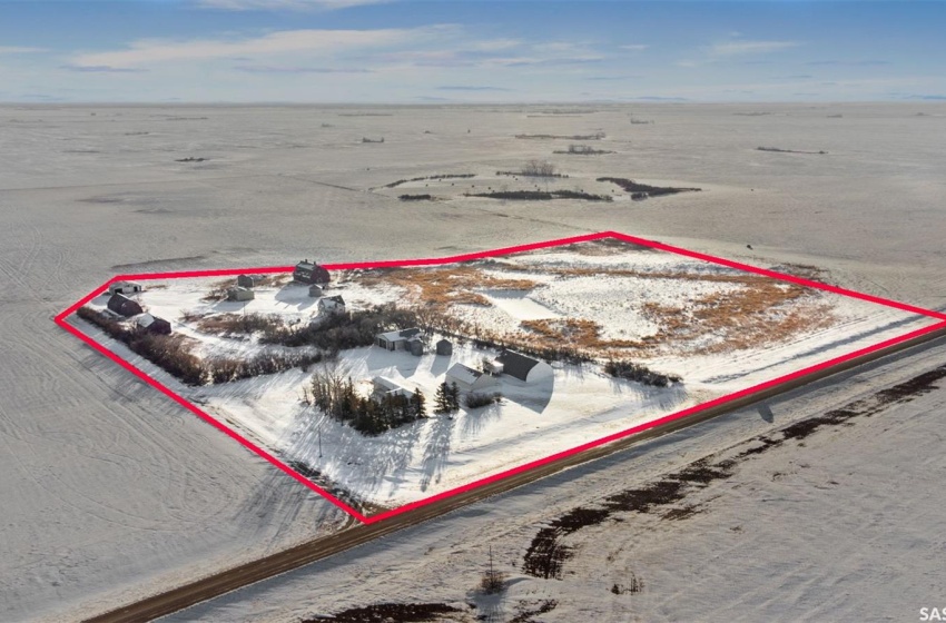 Snowy aerial view with a water view