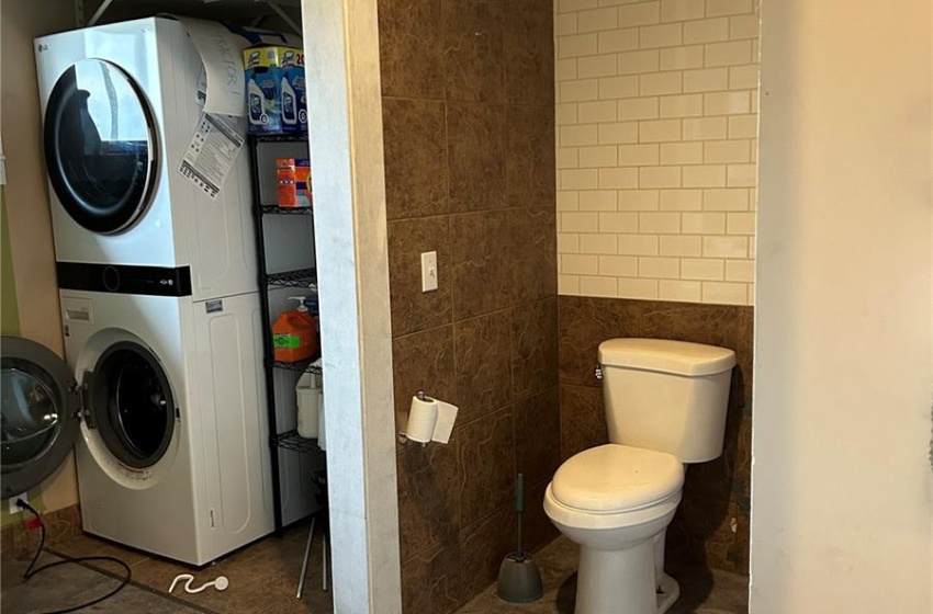 main floor Bathroom with  stacked laundry