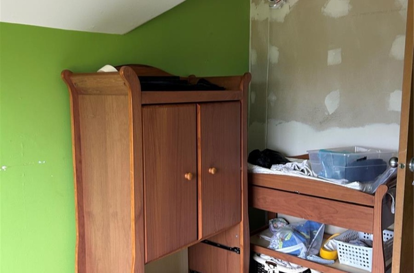 Unfurnished bedroom with hardwood / wood-style floors and a textured ceiling