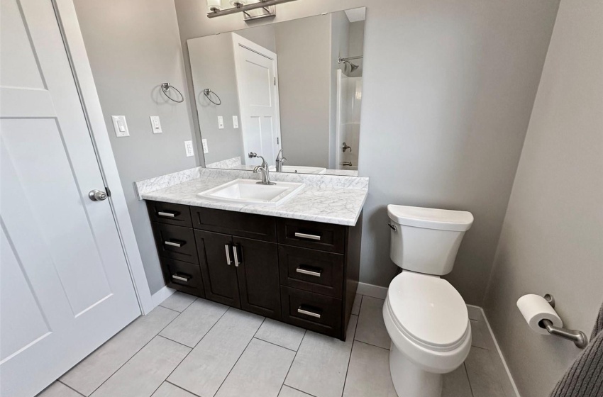 Main floor 4 piece bath with a window to the south.