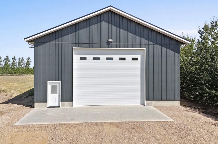 40 x 60 metal clad exterior and interior shop with a concrete floor, mezzanine, gas heat. 18' ceiling, 16' overhead door.