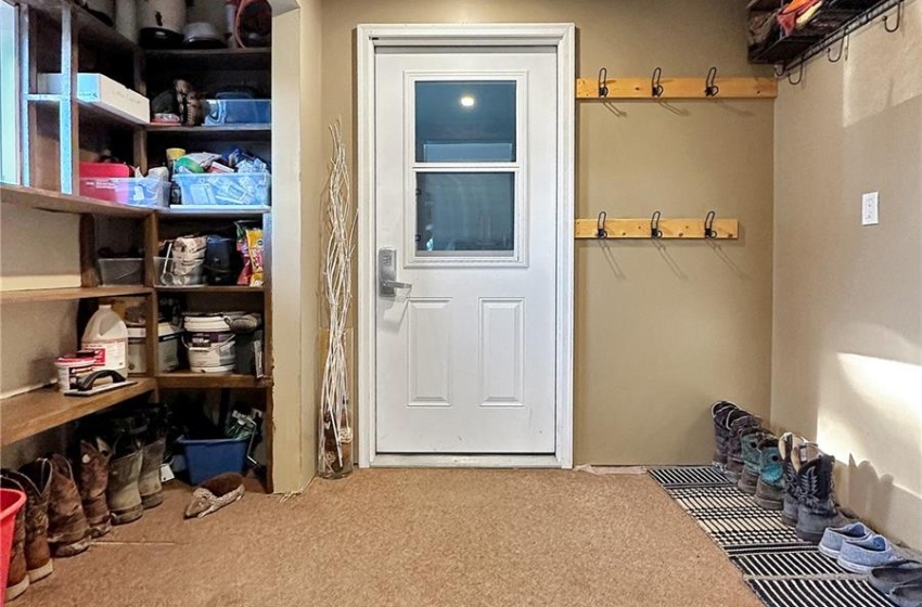 Porch off converted garage/storage to house entry