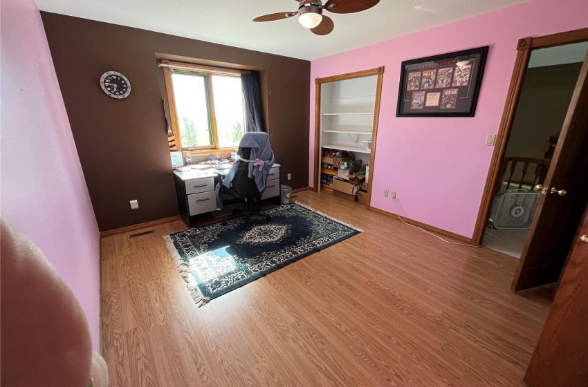 Office area featuring light hardwood / wood-style flooring and ceiling fan