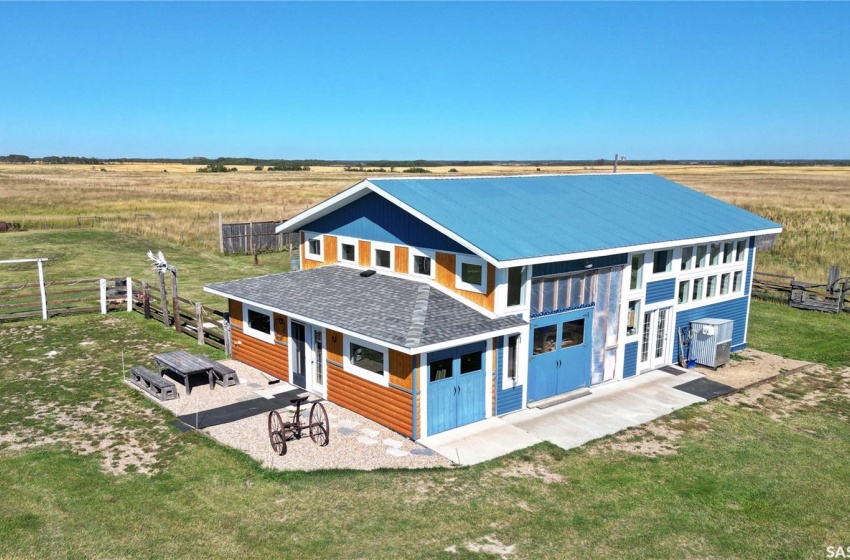 Back of house featuring a rural view and a patio area