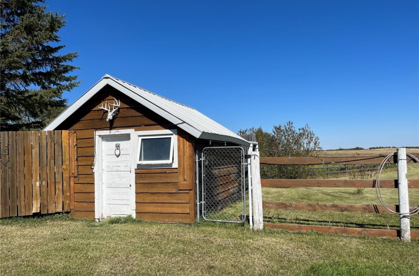 View of outdoor structure with a yard and a rural view