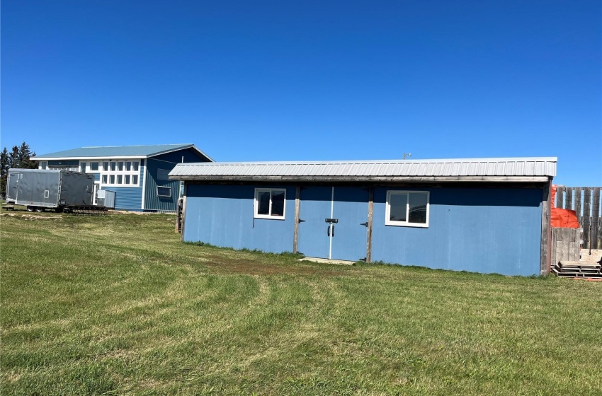 Back of house featuring a yard