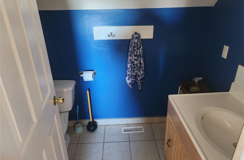 Bathroom with tile floors, toilet, and vanity