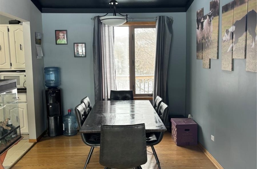 Dining area featuring light hardwood / wood-style floors and wood ceiling