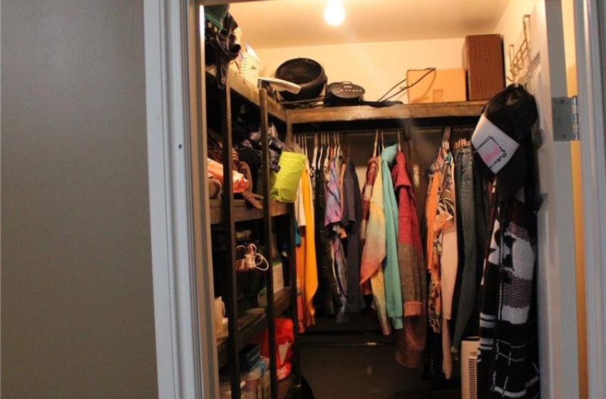 Spacious closet featuring hardwood / wood-style floors