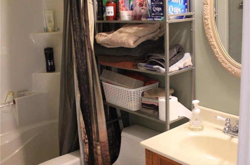 Full bathroom featuring vanity, tile patterned flooring, toilet, and shower / bath combo