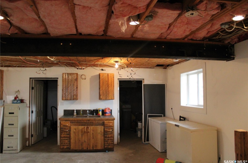 Kitchen featuring fridge and sink