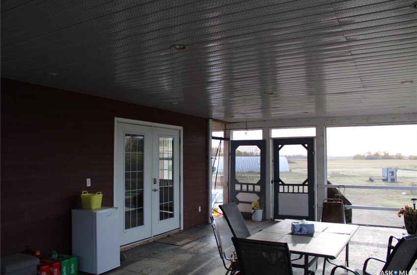 Sunroom featuring french doors