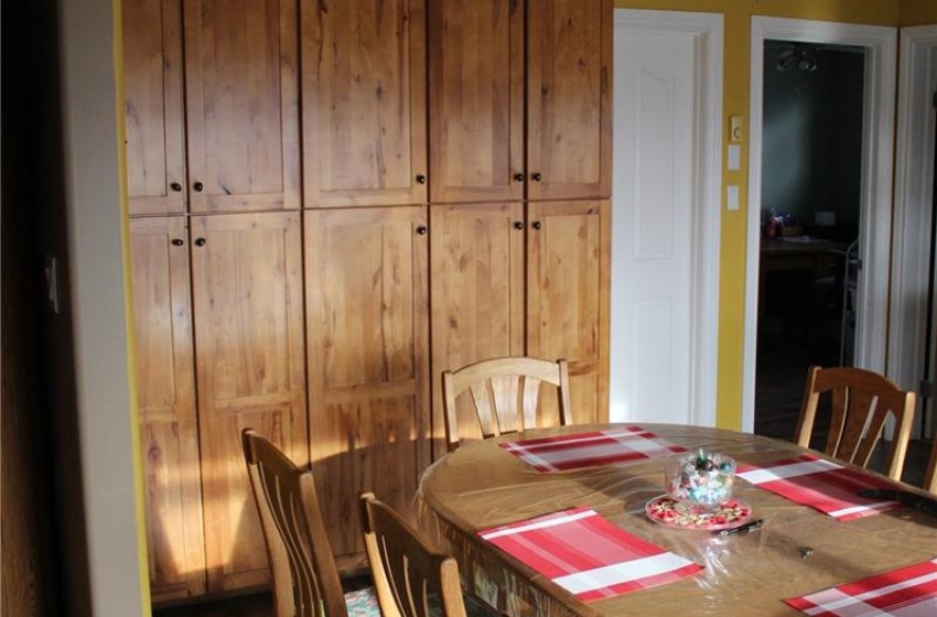 Tiled dining area featuring an inviting chandelier