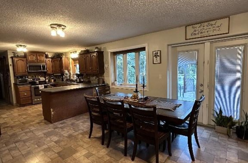 Dining room featuring a textured ceiling