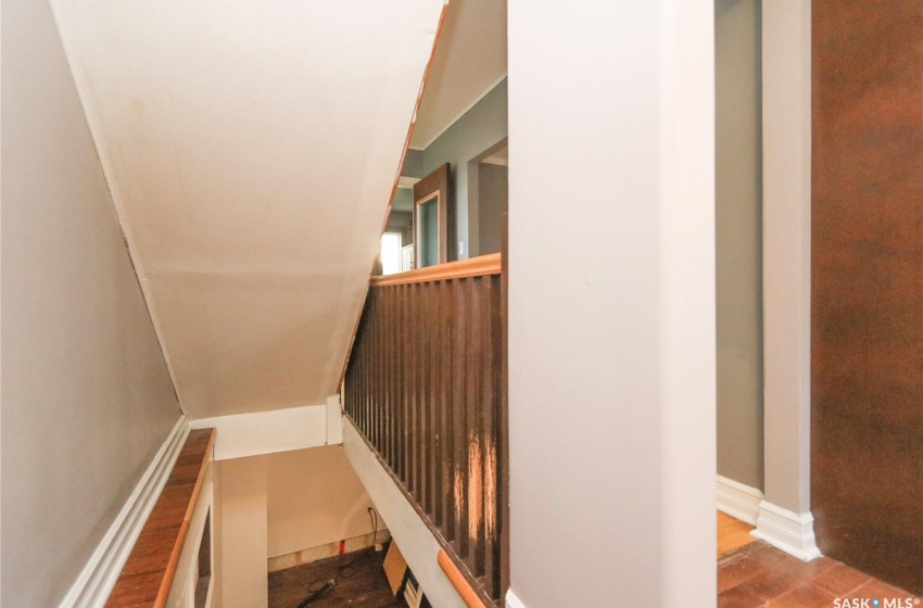 Stairs with hardwood / wood-style flooring