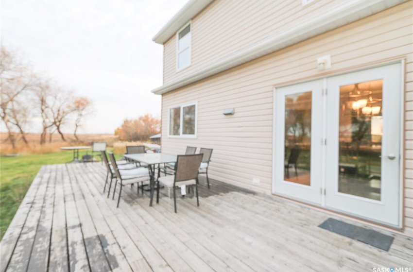 Wooden terrace featuring french doors