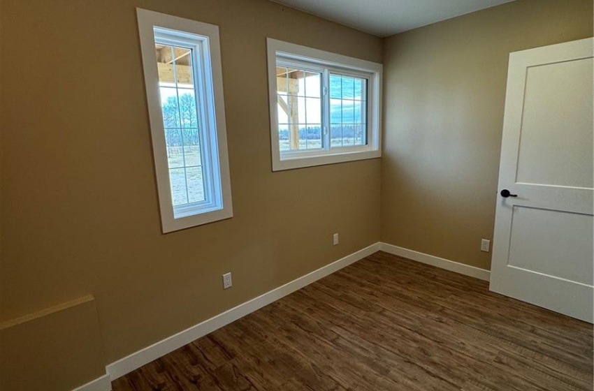 Main floor bedroom large window would make a great hobby room or office also.