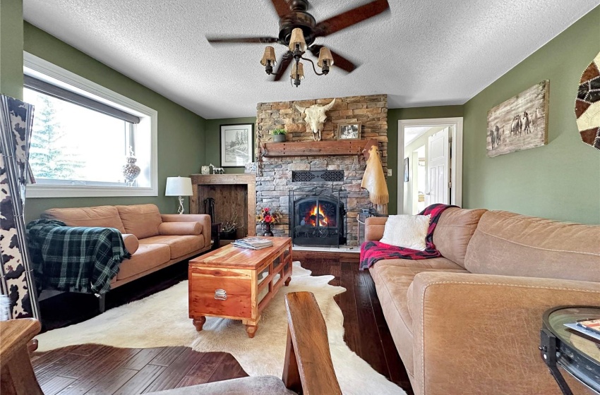 Wood fireplace in sitting room off dining room